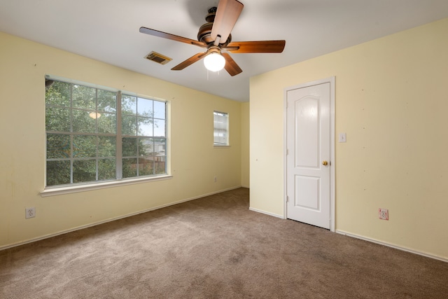 unfurnished bedroom featuring ceiling fan and carpet floors