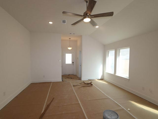 interior space featuring ceiling fan, a healthy amount of sunlight, and lofted ceiling