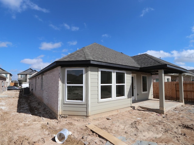 back of property with a patio