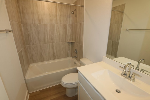 full bathroom with shower / washtub combination, toilet, vanity, and wood finished floors