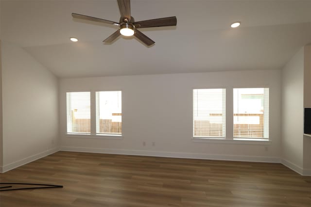 unfurnished room with recessed lighting, baseboards, lofted ceiling, and wood finished floors