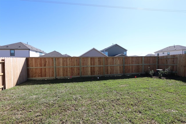 view of yard featuring a fenced backyard