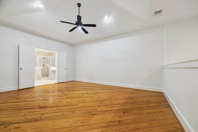 empty room featuring ceiling fan and light hardwood / wood-style flooring