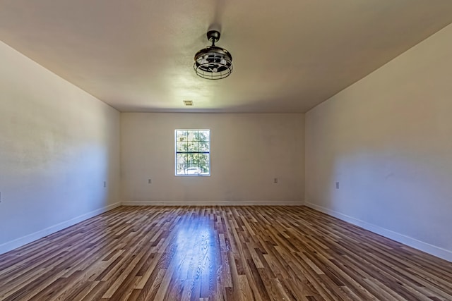 empty room with wood-type flooring