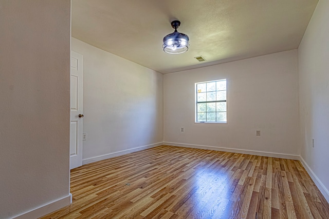 unfurnished room featuring light wood-type flooring