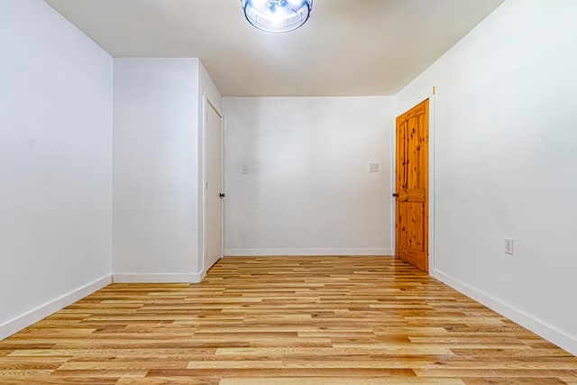 bonus room with light wood-type flooring