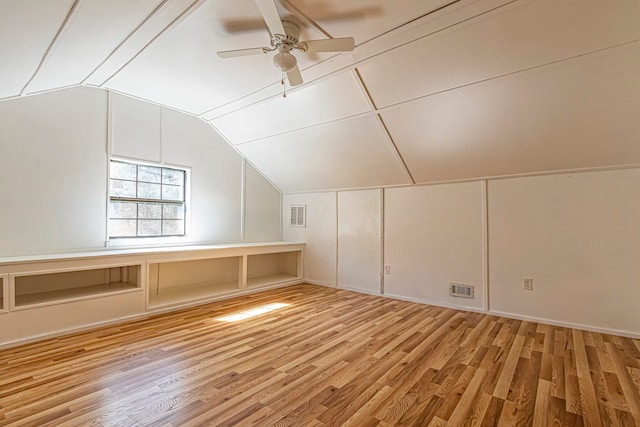 bonus room featuring wood-type flooring, ceiling fan, and vaulted ceiling