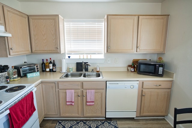 kitchen with light brown cabinets, white appliances, sink, and dark hardwood / wood-style floors