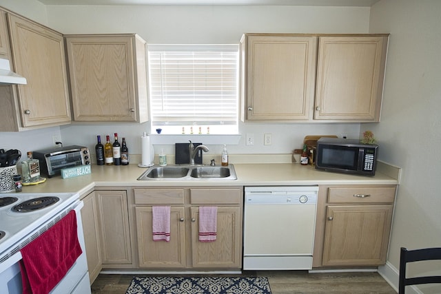 334 Sand Dune Ct, Surfside Beach, TX 77541 - kitchen with white appliances, a sink, light brown cabinets, dark wood-style flooring, and light countertops