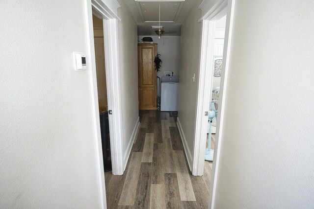 334 Sand Dune Ct, Surfside Beach, TX 77541 - hallway featuring attic access, wood finished floors, and baseboards