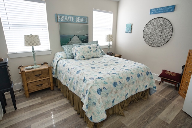 bedroom with hardwood / wood-style floors