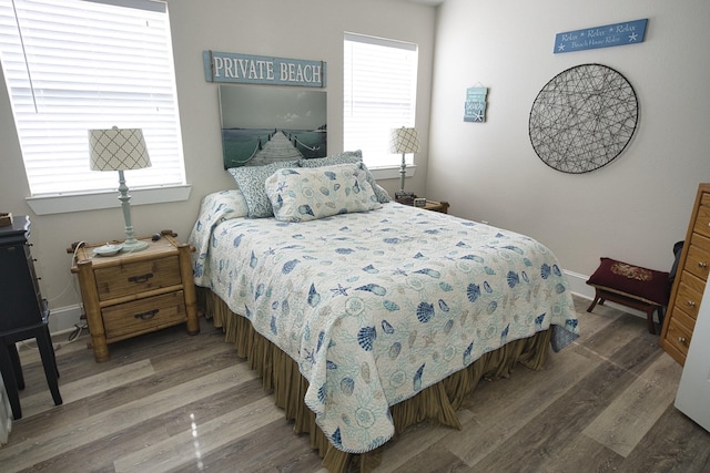 334 Sand Dune Ct, Surfside Beach, TX 77541 - bedroom featuring wood finished floors and baseboards