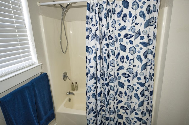 334 Sand Dune Ct, Surfside Beach, TX 77541 - bathroom featuring shower / bath combo with shower curtain