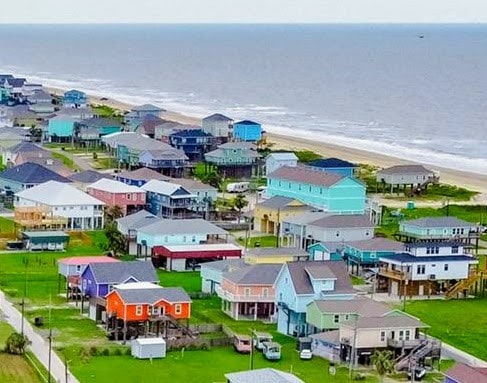 aerial view featuring a view of the beach and a water view