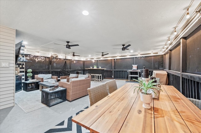 view of patio / terrace featuring an outdoor living space with a fire pit