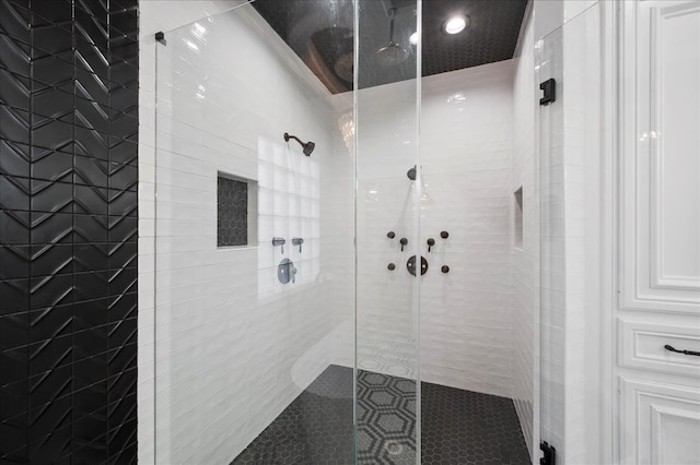 bathroom with a tile shower