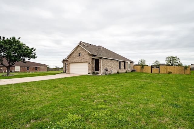 view of home's exterior with a garage and a yard