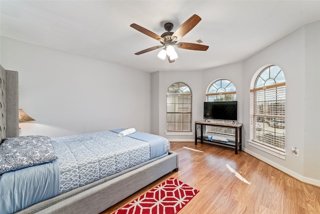 bedroom featuring wood-type flooring and ceiling fan