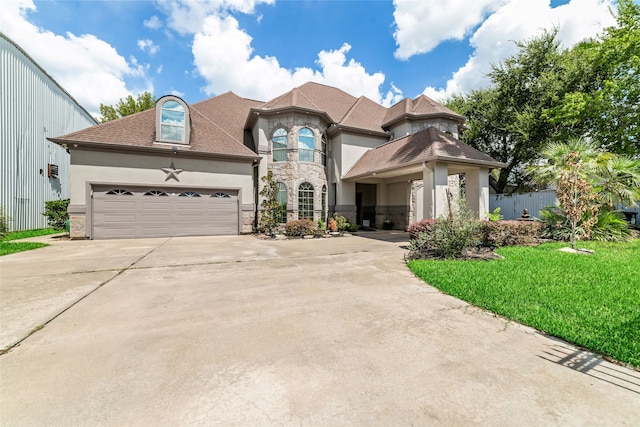 view of front of home featuring a garage and a front yard