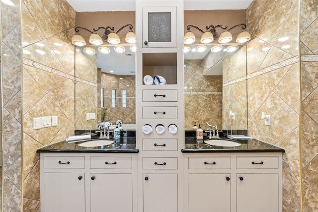 bathroom featuring tile walls, tasteful backsplash, and vanity