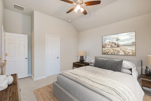 bedroom with vaulted ceiling, light carpet, and ceiling fan