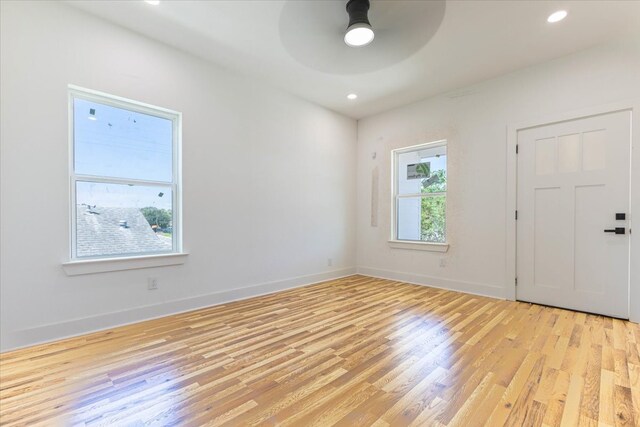 empty room featuring light hardwood / wood-style flooring and ceiling fan