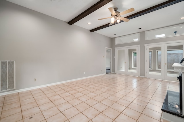 spare room with beam ceiling, ceiling fan, and light tile patterned floors