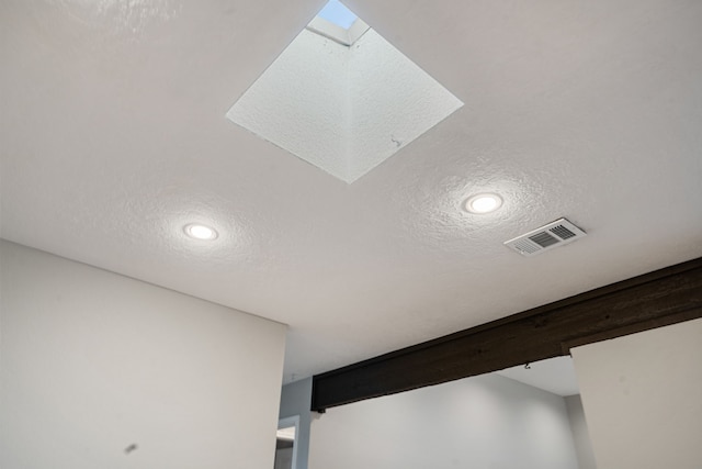 interior details featuring a textured ceiling