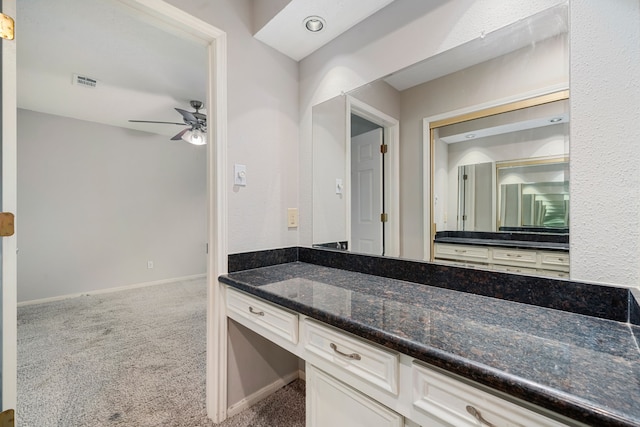 bathroom featuring vanity and ceiling fan