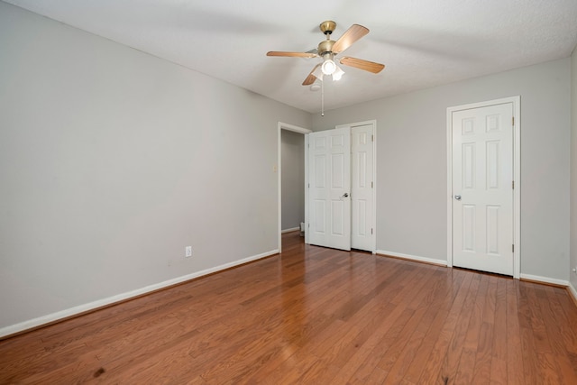 unfurnished bedroom with hardwood / wood-style floors and ceiling fan