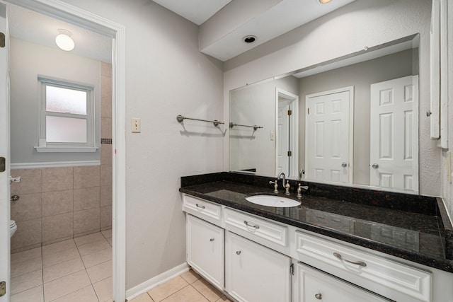 bathroom featuring tile patterned floors and vanity