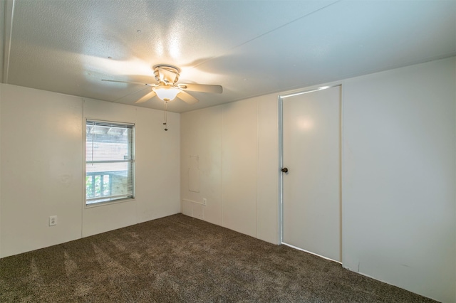 unfurnished room with carpet, a textured ceiling, and ceiling fan