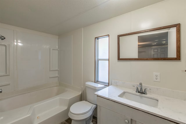 full bathroom featuring shower / bathing tub combination, vanity, a textured ceiling, and toilet