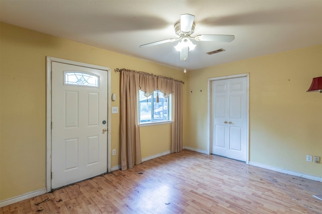 entrance foyer with ceiling fan and light hardwood / wood-style flooring