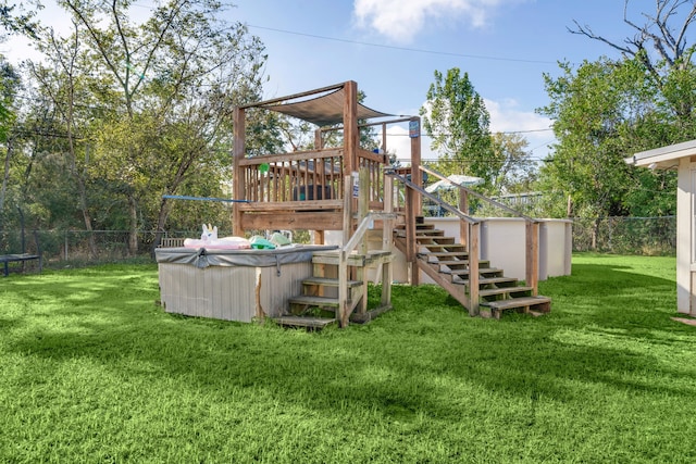 view of play area with a yard and a trampoline