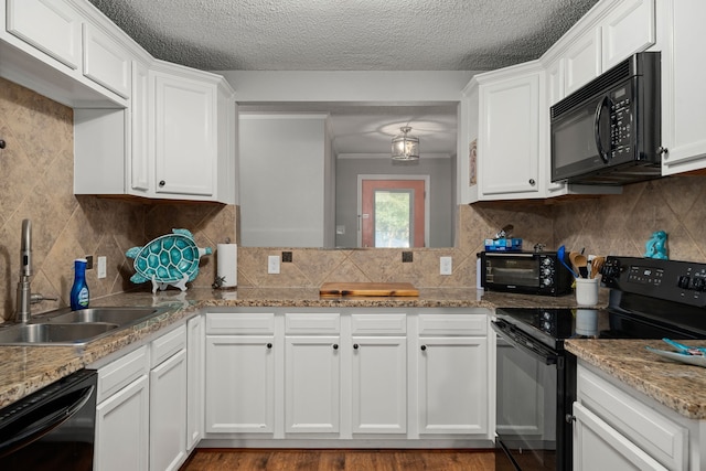 kitchen featuring white cabinets, light hardwood / wood-style floors, black appliances, and sink