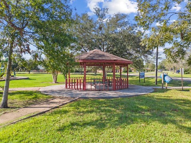 surrounding community with a yard and a gazebo