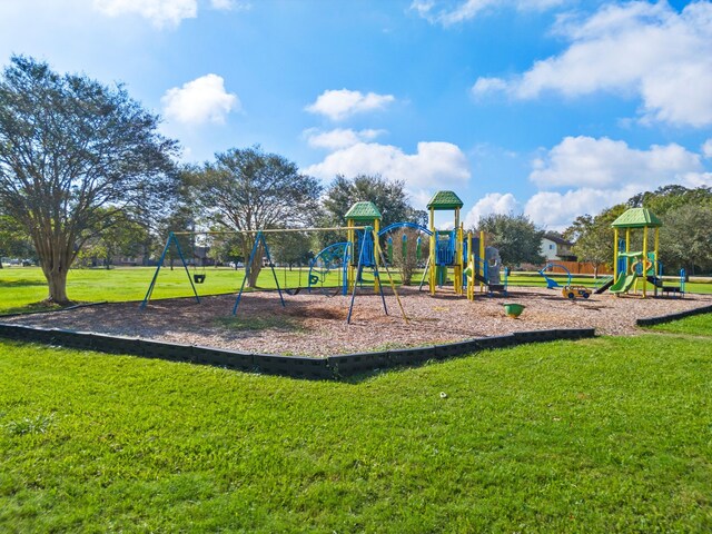 view of jungle gym featuring a lawn