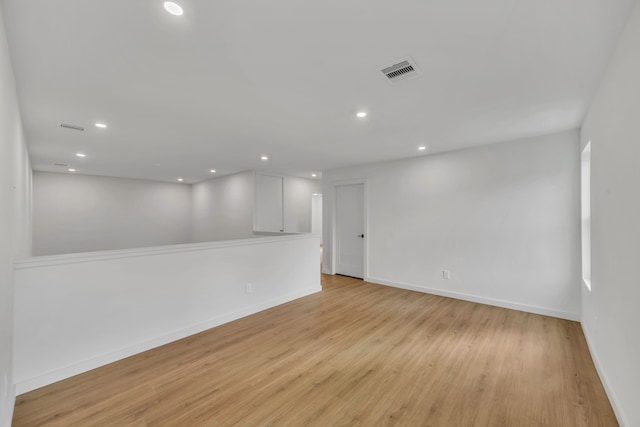 unfurnished room with light hardwood / wood-style flooring