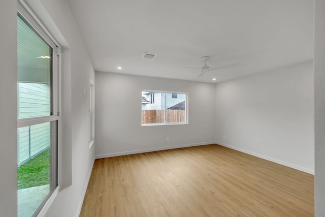 spare room with ceiling fan and light hardwood / wood-style flooring