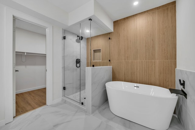 bathroom with separate shower and tub