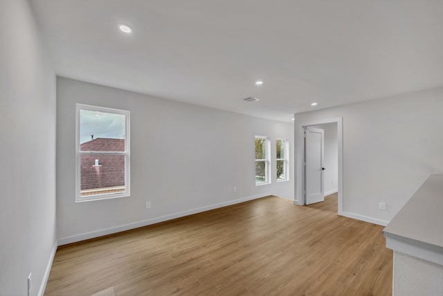 unfurnished living room with light hardwood / wood-style floors