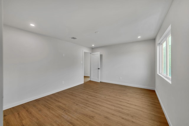 unfurnished room featuring light wood-type flooring