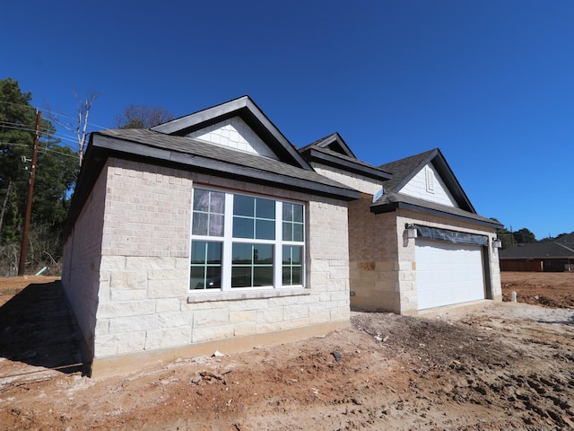 ranch-style home featuring a garage