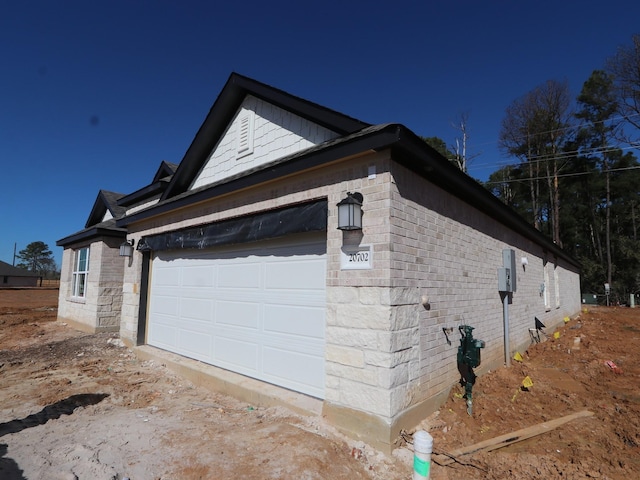 view of home's exterior with a garage