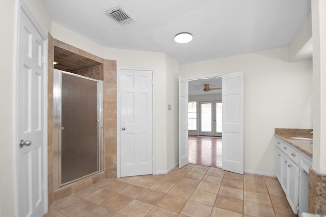 bathroom with french doors, vanity, an enclosed shower, tile patterned flooring, and ceiling fan