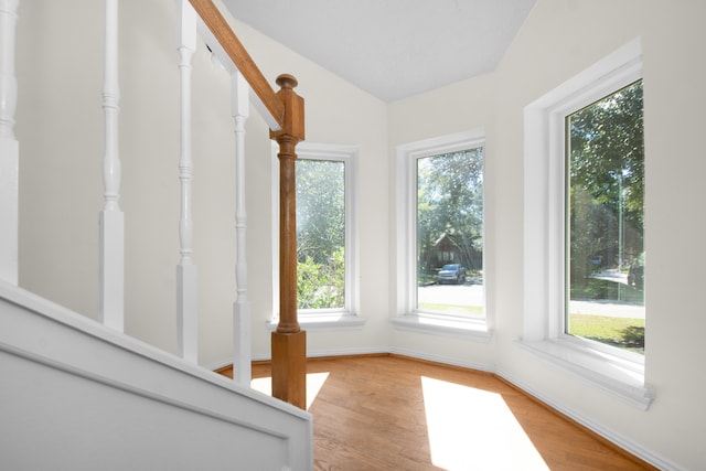 unfurnished sunroom with vaulted ceiling