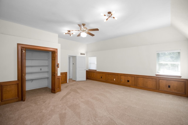 unfurnished bedroom featuring light carpet