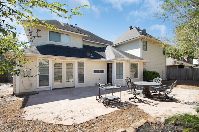 rear view of property featuring a patio and french doors