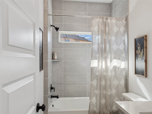 full bathroom with vanity, shower / bath combo with shower curtain, and toilet